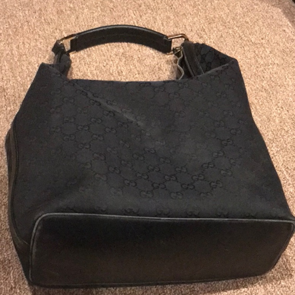 GUCCI!  Authentic Gucci shoulder bag in black logo print w leather trim.